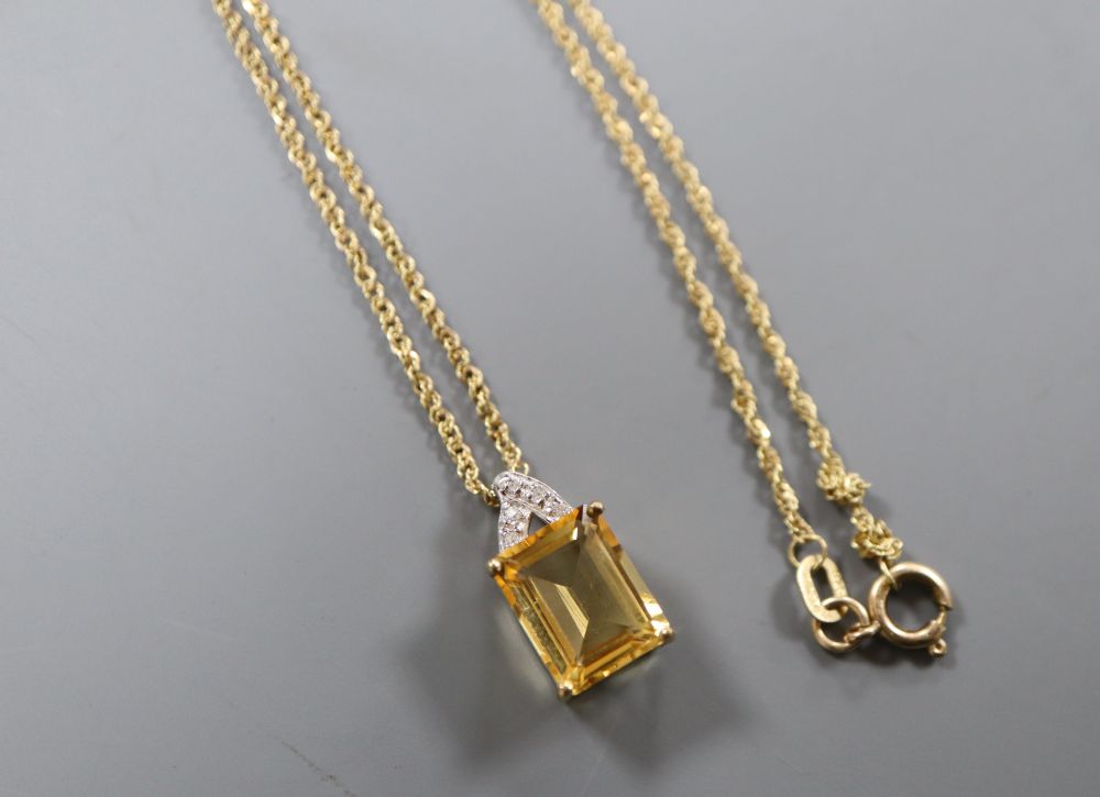 A citrine and diamond rectangular pendant on 9ct gold fine chain, chain 38mm, pendant 15mm, gross 2.6 grams.